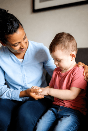 Therapist and child working together on a learning activity with evidence-based support