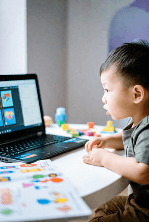 Woman tutoring a young boy in a focused, one-on-one learning setting