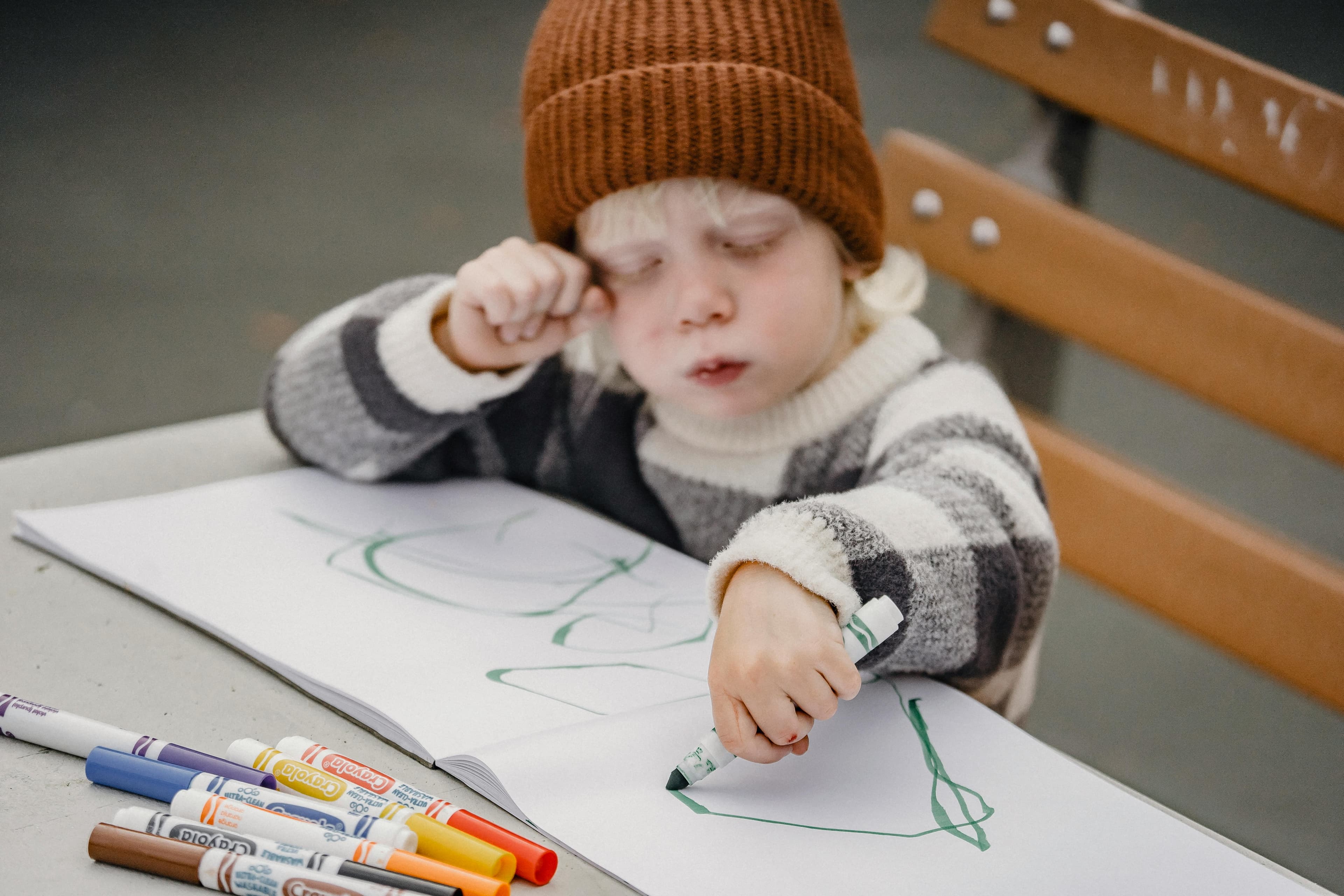 Therapist supporting a child during a learning activity